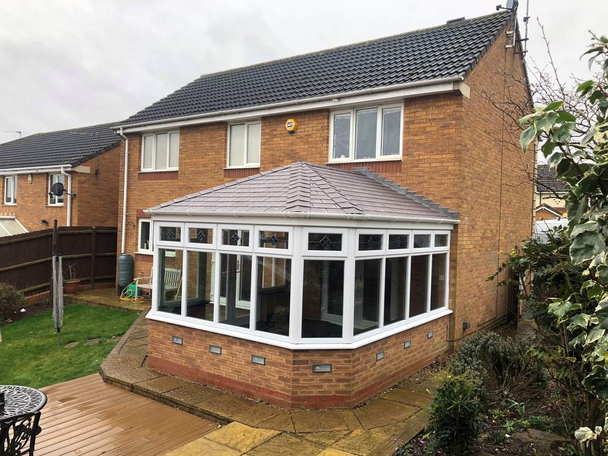 After: glass roof replaced with a tiled roof in Pewter Grey