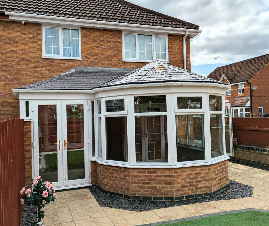 After: victorian glass roof replaced with a tiled roof in Pewter Grey