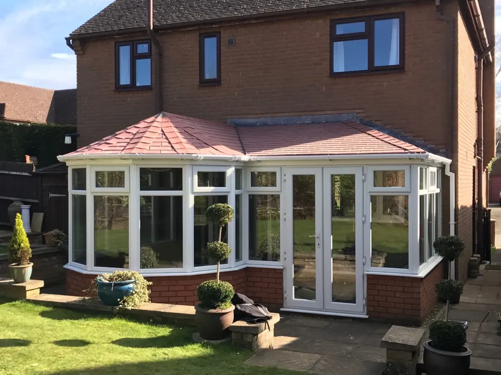 P Shape conservatory with a tiled roof fitted by Nu-Look